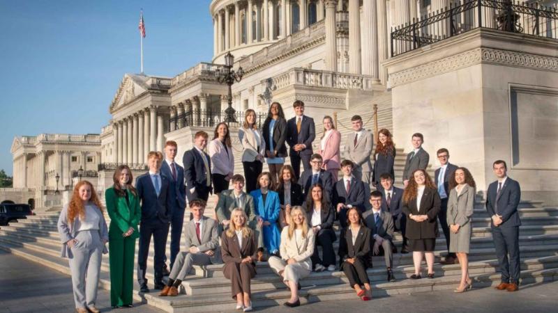 students together in a group at a monument in Washington